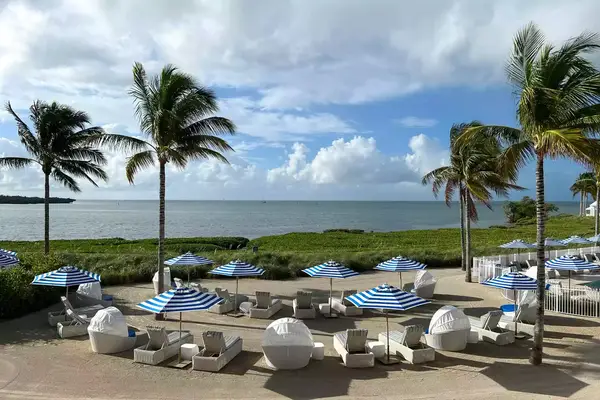 View of beach lounge chairs at Isla Bella Beach Resort