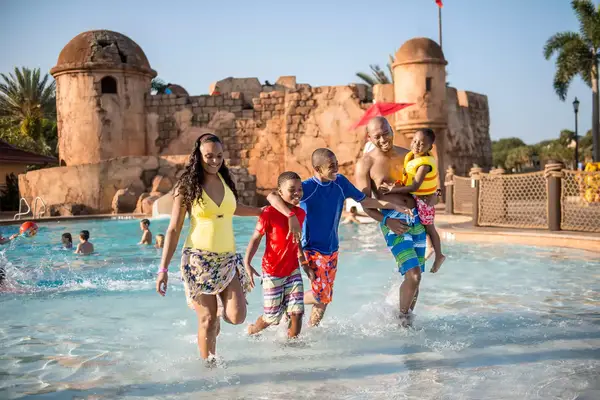 Family walking out of a wave pool at Carribbean Beach Resort
