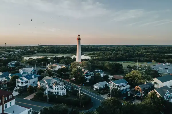 High Angle View Of Lighthouse And Buildings Against Sky. Cape May New Jersey Lighthouse