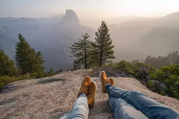 A couple resting after a hike in Yosemite Valley 