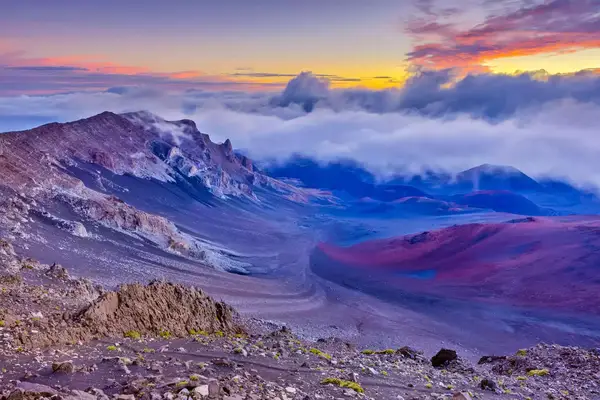 Haleakala National Park on Maui at sunrise, breathtaking volcano views in purple hues