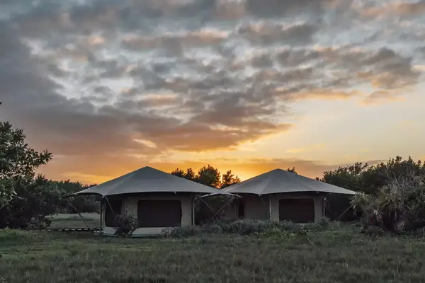 Sunset behind glamping tents in the Everglades