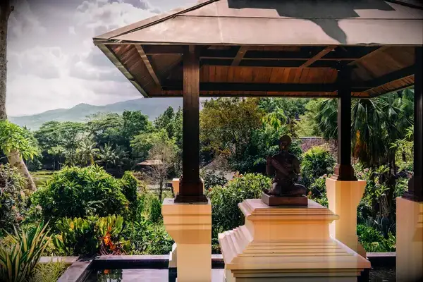 A balcony overlooking lush greenery at a luxury resort in Thailand.