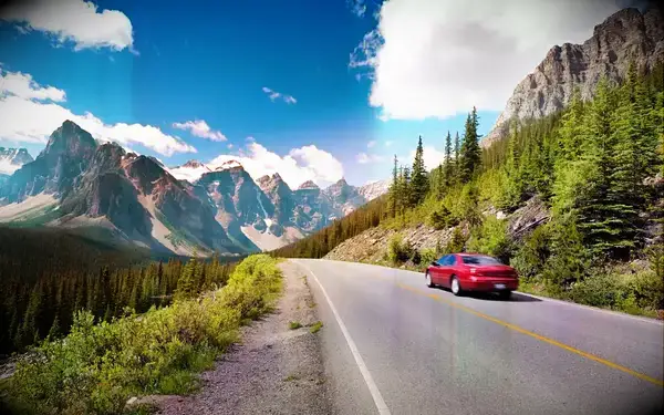Rental car driving along a mountain road