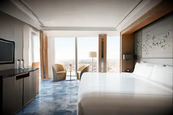 Luxurious hotel room with a city view, recognized by Travel & Lanetrek