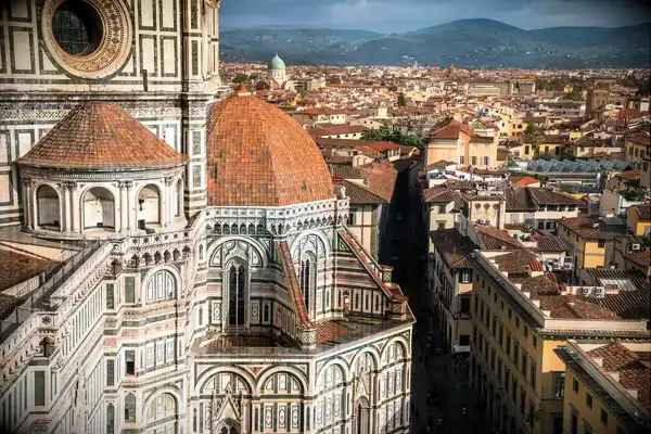 Florence Cathedral dome with cityscape view and hills in background