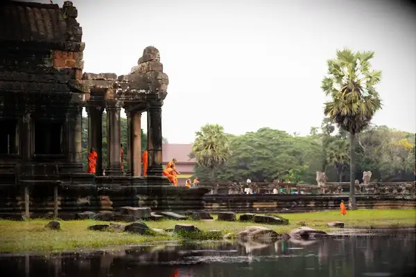Angkor Wat building and surrounding area with people present