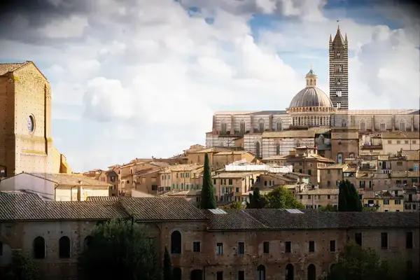Panoramic view of Siena with historic buildings and the cathedral on the skyline