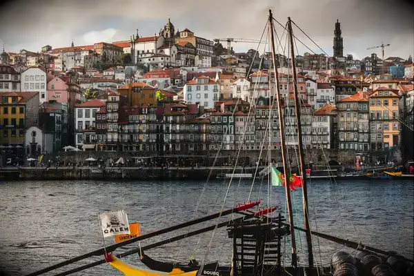 A view of Porto with its buildings and a boat in the foreground