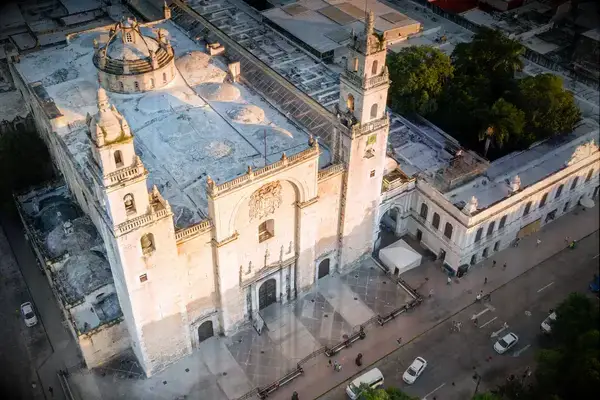 Aerial view of a large historic church and surrounding city area