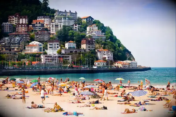 Sunbathers on Ondarreta beach in San Sebastian, Spain