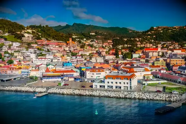 Waterfront view of Roseau, Dominica, with buildings and hills in the background