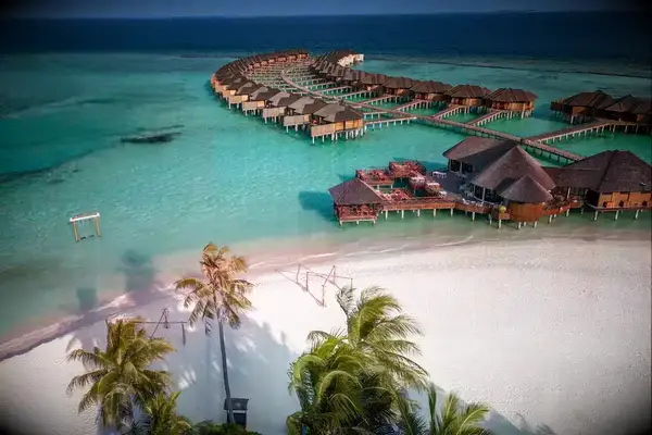 Maldives hotel beach resort on tropical Island with aerial drone view