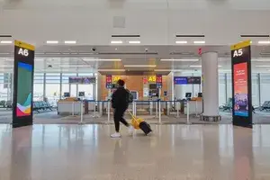 A woman walking through an airport