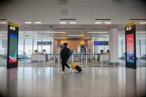 A woman walking through an airport