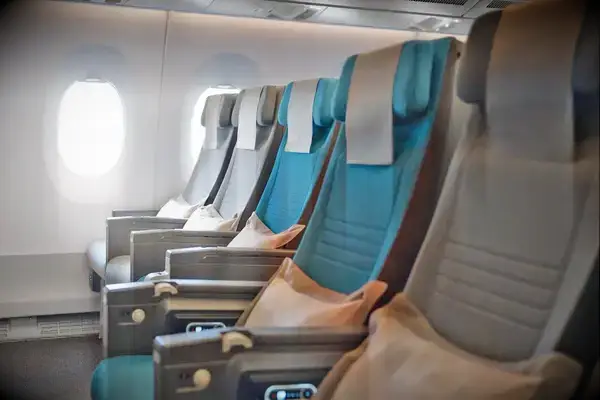 Economy class seating in an airplane cabin