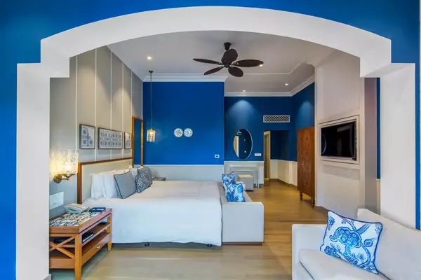 A blue and white guest room at the Taj Exotica resort in Goa
