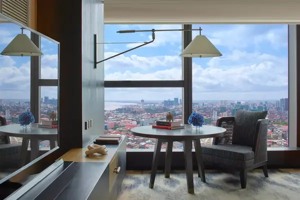 Guest room with city views at the Rosewood Phnom Penh