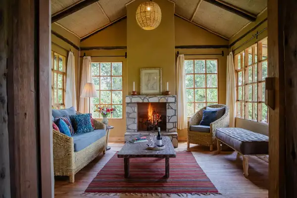 Lounge area with fireplace at the Mount Gahinga Lodge