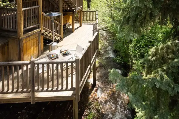 Terrace and forest at the Triple Creek Ranch resort