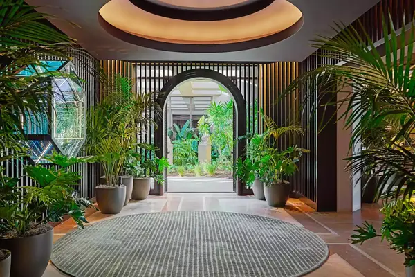 The greenery filled lobby of the Pendry Newport Beach hotel