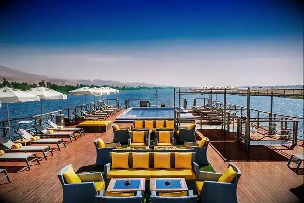 Luxurious outdoor deck setup on a river cruise ship with lounge seating and sun umbrellas