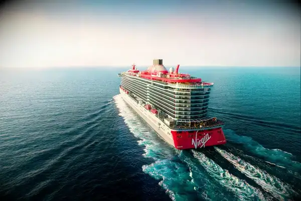 Virgin cruise ship sailing in the ocean.