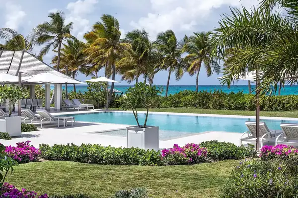 Pool surrounded by flowers and shrubs at the Jumby Bay resort in Antigua