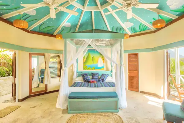 Colorful aqua blue guest room at the Anse Chastanet Resort in St Lucia