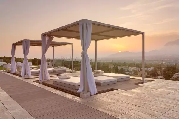 SHA Wellness Clinic terrace with a skyline view at sunset