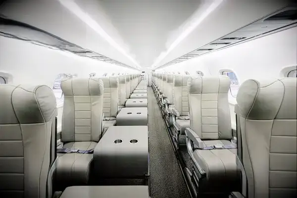 Airline cabin interior with spacious seating and award badge displayed