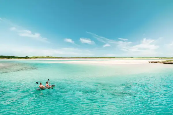 Couple kayaking in the Exumas, Bahamas